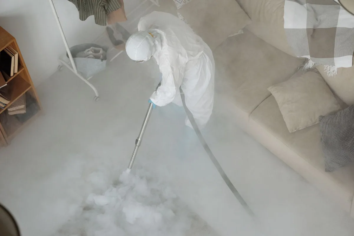 Biohazard cleanup technician in protective equipment, Harbour Island, Tampa, FL